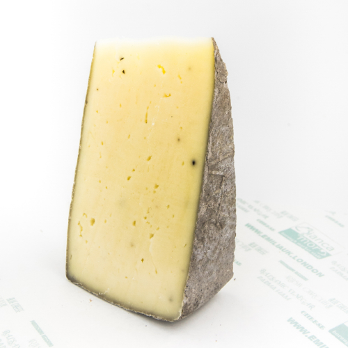 Truffle cow`s milk cheese, italian